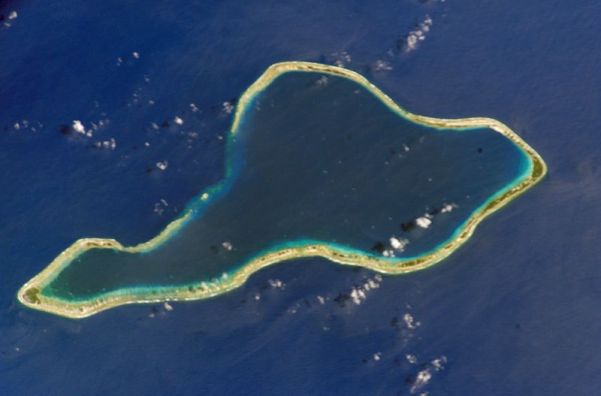 Top: Moruroa Atoll. Bottom: Fangataufa Atoll, French Polynesia, sites of French nuclear tests. The dark blue waters in the upper lagoon of Fangataufa mark the deep crater created by bomb explosions. Credit: NASA, via Wikimedia Commons. Top: Moruroa Atoll. Bottom: Fangataufa Atoll, French Polynesia, sites of French nuclear tests. The dark blue waters in the upper lagoon of Fangataufa mark the deep crater created by bomb explosions. Credit: NASA, via Wikimedia Commons.