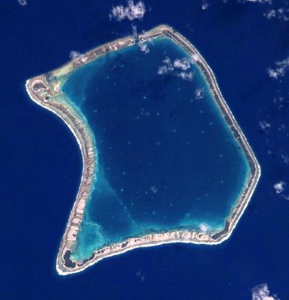 Top: Moruroa Atoll. Bottom: Fangataufa Atoll, French Polynesia, sites of French nuclear tests. The dark blue waters in the upper lagoon of Fangataufa mark the deep crater created by bomb explosions. Credit for both: NASA, via Wikimedia Commons. Top: Moruroa Atoll. Bottom: Fangataufa Atoll, French Polynesia, sites of French nuclear tests. The dark blue waters in the upper lagoon of Fangataufa mark the deep crater created by bomb explosions. Credit for both: NASA, via Wikimedia Commons.