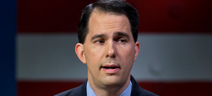 Scott Walker caught a break when a federal judge halted a campaign finance investigation. (photo: AP)