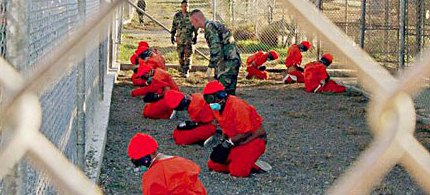 Detainees at Guantanamo Bay are watched by military police. (photo: Reuters)