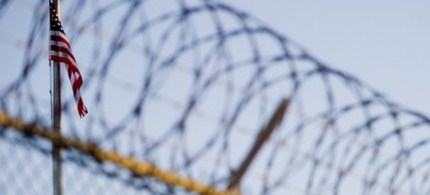 The flag and barbed wire within a detention facility at Guantanamo Bay. (photo: Getty Images) The flag and barbed wire within a detention facility at Guantanamo Bay. (photo: Getty Images)