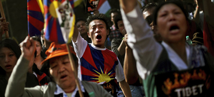 Exiled Tibetans shout slogans during a protest rally to express solidarity with Tibetans who have self-immolated and to appeal for immediate international intervention in New Delhi, India, Wednesday, November 28, 2012. At least 86 people have set themselves on fire since the immolations began in 2009. (photo: Altaf Qadri/AP)