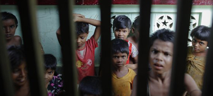 This village in northwest Myanmar has the besieged air of a refugee camp. It is clogged with people living in wooden shacks laid out on a grid of trash-strewn lanes. Its children are pot-bellied with malnutrition. (photo: The International News)