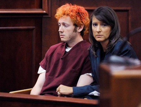 A seemingly completely drugged individual alleged to be James Holmes, yet appearing to be someone totally different, is seen barely able to stay awake next to a very quiet defense attorney in a court and case that has been suspect from the very beginning.