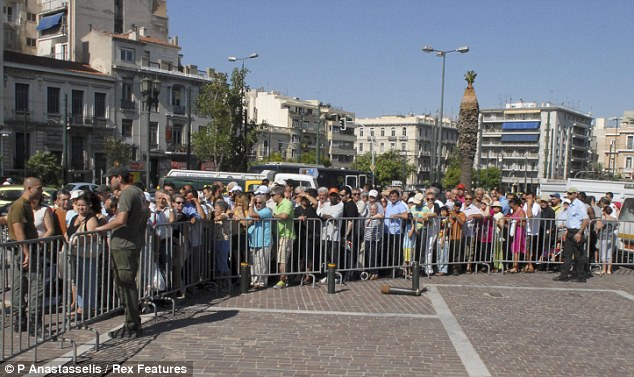 Hungry: Greeks line up for the food handouts, donated by Crete's farmers