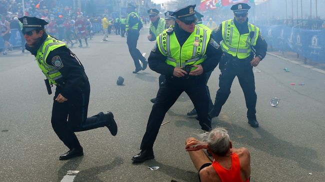 Police react after the Boston Marathon bombings, April 15, 2013.