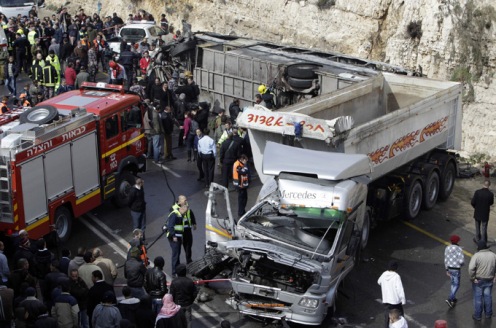 Ramallah-A truck crashed into a Palestinian school bus, killing at least eight people including seven children