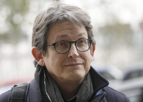 The editor of The Guardian Alan Rusbridger arrives at Portcullis House in London December 3, 2013. REUTERS/Luke MacGregor