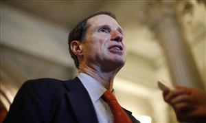 Sen. Ron Wyden, D-Ore., speaks to reporters after leaving the floor of the Senate on Capitol Hill in Washington, Thursday, April 14, 2011.